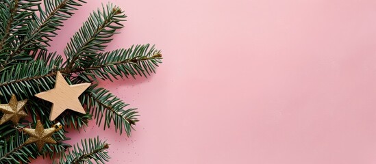 Aufkleber - Craft paper-wrapped Christmas tree branches on a pink backdrop, with a wooden star nearby, creating a festive scene with copy space image.