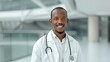 © DARIKA - African doctor smiling while consulting with a patient in a modern clinic representing medical knowledge and compassion Portrait, Realistic Photo, High resolution, Half-body picture, Minimalism,