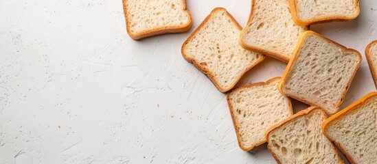Poster - White and gray bread slices displayed on a white surface with copy space image.