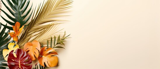 Wall Mural - Colorful and golden tropical leaves and palms on a beige backdrop create a minimal summer exotic theme with an area for text, forming a border arrangement for a photo or design