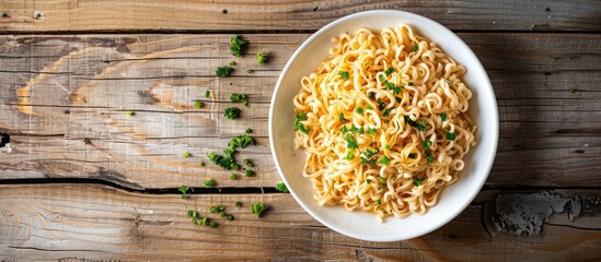 Poster - Half a plate of instant noodles placed on a wooden table with ample copy space image.