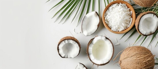 Poster - Flat lay composition of coconut spa products on a white background with copy space image, highlighting natural spa cosmetics and organic treatments.