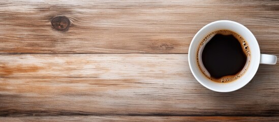 Sticker - Top view of a white cup filled with hot coffee, ready to be enjoyed, with ample copy space image.