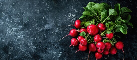 Poster - Fresh radishes in a large bunch, arranged in a top-view perspective on a black background, offering ample space for text with a copy space image.