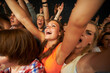 © ArcursPI/peopleimages.com - These girls love their music. Attractive female fans enjoying a concert.