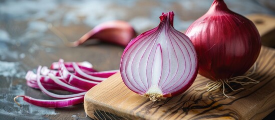 Aufkleber - Half a red onion displayed on a wooden board with copy space image.