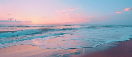 Poster - Seascape with a serene beach at sunset. The horizon filled with a blend of blue and pink hues, creating a tranquil setting for the copy space image.