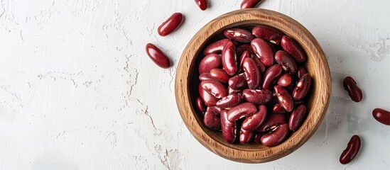 Poster - Wooden bowl filled with red canned beans on a white background, providing ample copy space image.