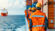 © crazyass - Diverse crew working on cargo ship, World Maritime Day, teamwork and industry.