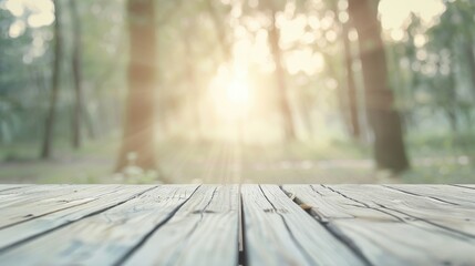 Wall Mural - A wooden table with a view of trees and a sun shining through the leaves