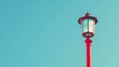 © 2rogan - Vintage gaslight street lamp on tall red wooden pole against clear summer sky