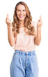 © Krakenimages.com - Young beautiful caucasian woman with blond hair wearing casual clothes showing middle finger doing fuck you bad expression, provocation and rude attitude. screaming excited