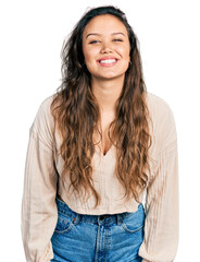 Wall Mural - Young hispanic girl wearing casual clothes with a happy and cool smile on face. lucky person.