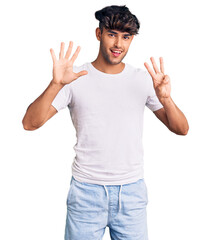 Sticker - Young hispanic man wearing casual clothes showing and pointing up with fingers number eight while smiling confident and happy.