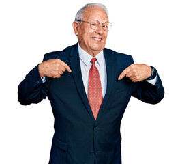 Canvas Print - Senior man with grey hair wearing business suit and glasses looking confident with smile on face, pointing oneself with fingers proud and happy.