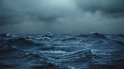 Wall Mural - noir style photograph of moody waves in shades of slate and charcoal crashing under an overcast sky 