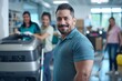 © Oksana - Portrait of a smiling man in a teal shirt in a workplace with cleaning equipment. Professional cleaner concept
