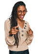 © Krakenimages.com - African american woman wearing casual clothes pointing fingers to camera with happy and funny face. good energy and vibes.