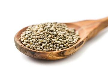 Poster - A wooden spoon filled with seeds on a white background, great for food and nature photography