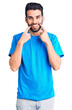 © Krakenimages.com - Young handsome man with beard wearing casual t-shirt smiling with open mouth, fingers pointing and forcing cheerful smile