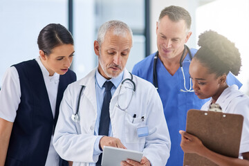 Poster - Your health is our priority. Cropped shot of doctors in the hospital.