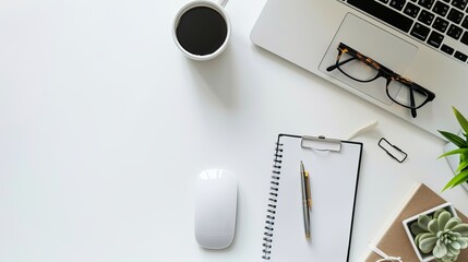 Wall Mural - Top view of office essentials including a notepad laptop coffee cup mouse pad and mobile phone with a blank screen Copy space available on the desk workspace
