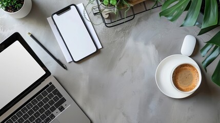Wall Mural - Top view of office essentials including a notepad laptop coffee cup mouse pad and mobile phone with a blank screen Copy space available on the desk workspace