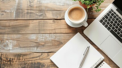 Wall Mural - Work from home concept Office desk setup with a laptop blank notepad coffee cup and pen on a wooden table Top view with copy space in a flat lay style