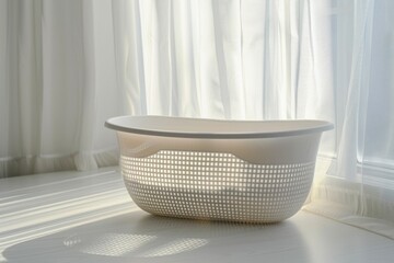 Poster - A white bath tub sits in front of a window, providing natural light and a view