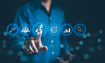 Business Growth Strategy Concept. Businessman touching virtual digital icons representing business growth strategies, including rocket launch, target achievement, analytics, and teamwork. innovation,