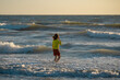 © Volodymyr - Little kid boy running on summer beach. Happy amazed kid running on summer sea. Cute child running near ocean on summer day. Kids run have fun on beach. Kid play in splash sea water. Summer rest.