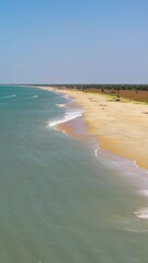 Wall Mural - Seascape with tropical sandy beach and blue ocean. Sri Lanka. Thaalayadi Beach. Summer and travel vacation concept.