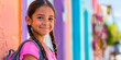 © Gabriela - Latin girl with backpack on her back, colorful houses background
