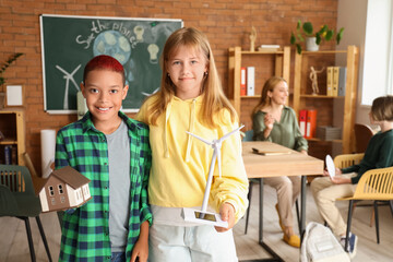 Poster - Pupils with wind turbine and house model in classroom. Ecology concept