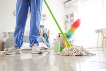 Wall Mural - Janitor mopping floor in dorm room, closeup