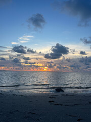 Wall Mural - ocean sunset on the beach in florida with colorful skies.