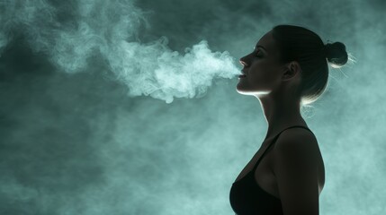 Canvas Print - woman exhaling smoke in dark atmosphere