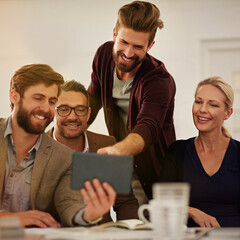 Poster - I like this one. Cropped shot of a group of businesspeople looking at a tablet in the boardroom.