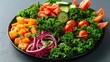 © PBMasterDesign - Fresh and colorful salad with kale, tomatoes, cucumbers, red onions, and bell peppers, beautifully arranged in a black bowl.