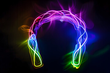 Wall Mural - Neon outline of a horseshoe with rainbow light trails isolated on black background.