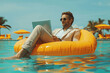 © btiger - Remote Work Concept: Businessman Floating on Inflatable Chair Using Laptop in Pool with Sunglasses