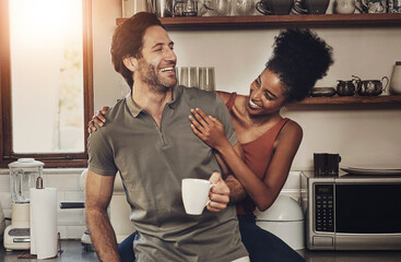 Poster - Interracial couple, together and happiness with coffee in kitchen for wellness, morning routine or bonding in home. Man, woman and smile in house with tea for health, relax with partner or care