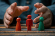 © btiger - Business Conflict Mediation: Man Helping Red and Green Figures for Resolution and Active Communication