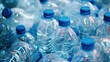 © innova - Close up of many plastic water bottles with blue caps. Concept of recycling, pollution, waste, and the environment.