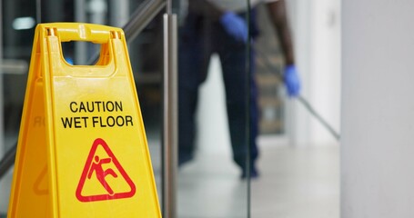 Poster - Caution, sign and cleaning for floor, janitor and hygiene service and dark at night in office. Mop, job and disinfection with equipment with warning and male person, disinfectant and wet ground