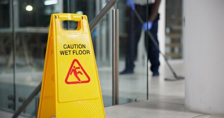 Poster - Caution, sign and cleaning for floor, janitor and hygiene service and dark at night in office. Mop, job and disinfection with equipment with warning and male person, disinfectant and wet ground