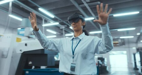 Leinwandbilder - Portrait of a Female Engineer Using a Mixed Reality Headset and Gesturing with Her Hands in the Air. Technician Working with Futuristic Equipment. Arc Footage in an Industrial Factory Environment