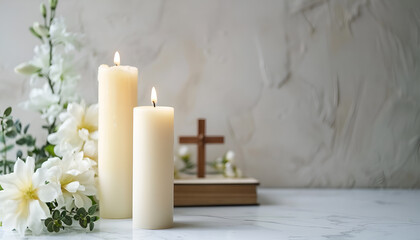 Wall Mural - Burning church candles, wooden cross, Bible and flowers on white marble table. Space for text