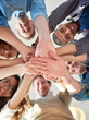 © Rosy/peopleimages.com - Getting it done through teamwork. Low angle shot of a group of co-workers stacking their hands on top of each other.