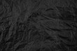 © oleh11 - Black crumpled paper texture pattern. Rough grunge old blank.